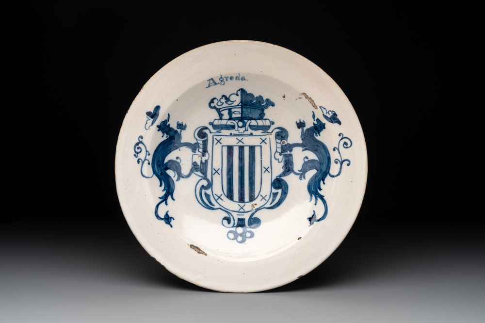 A blue and white Spanish armorial dish with the arms of Agreda, Talavera, 18th C.