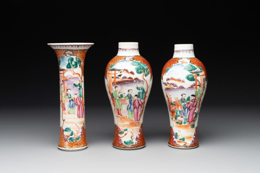 A Chinese famille rose 'mandarin subject' garniture of three vases, Qianlong