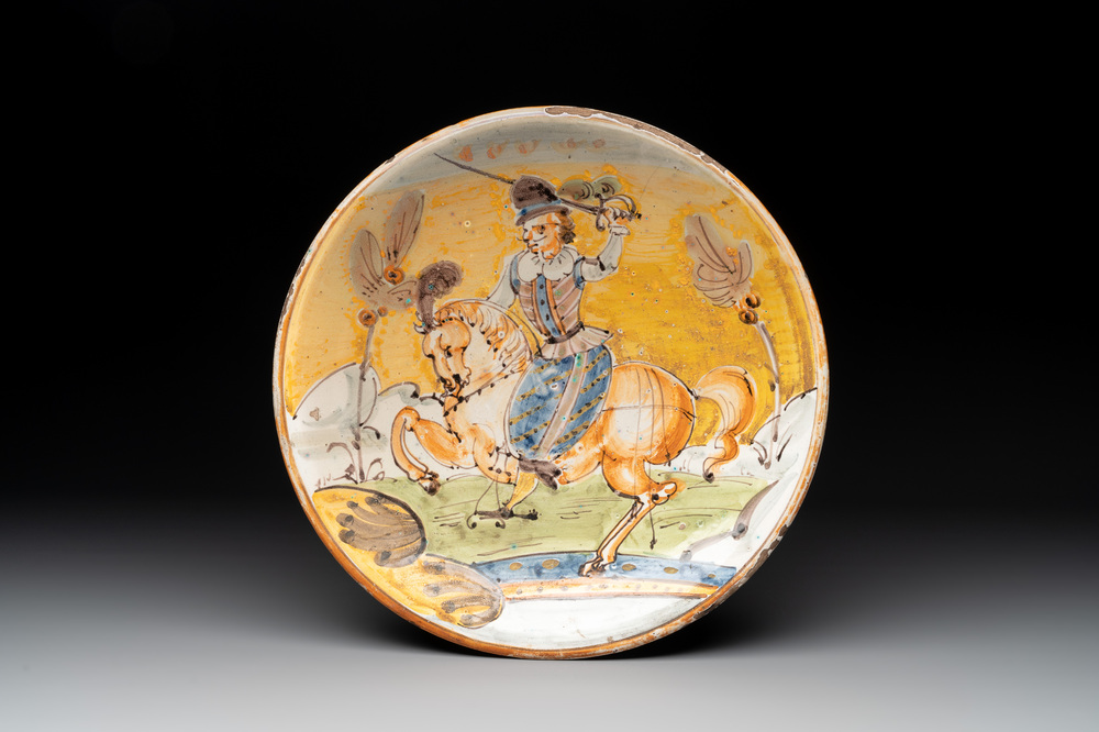 An Italian maiolica dish with a swordsman on horse, Montelupo, early 17th C.