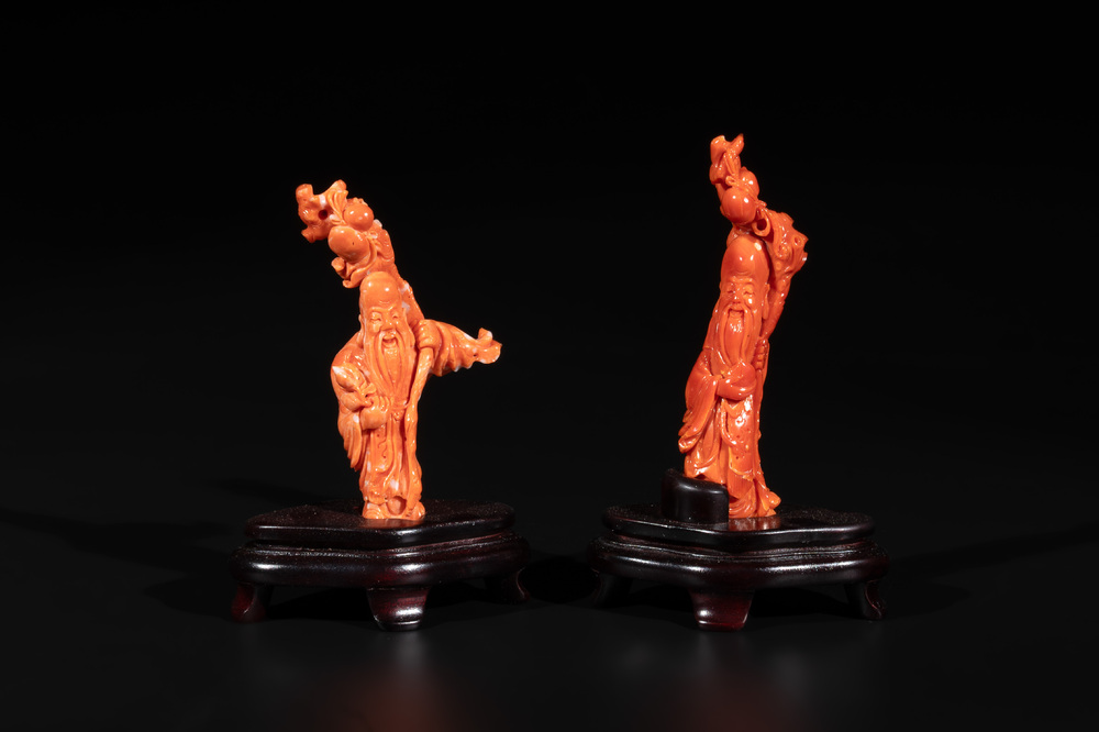 Two Chinese red coral figures of Shoulao on wooden stand, 19/20th C.