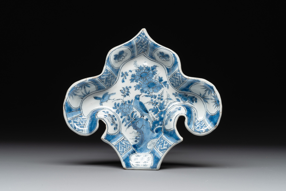 A blue and white Dutch Delft fleur-de-lys-shaped 'chinoiserie' dish, late 17th C.