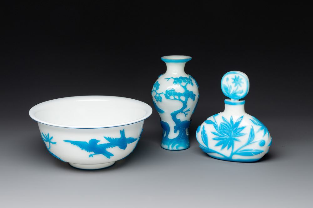 A Chinese blue-overlay white Beijing glass 'meiping' vase, a bowl and a bottle, 19/20th C.