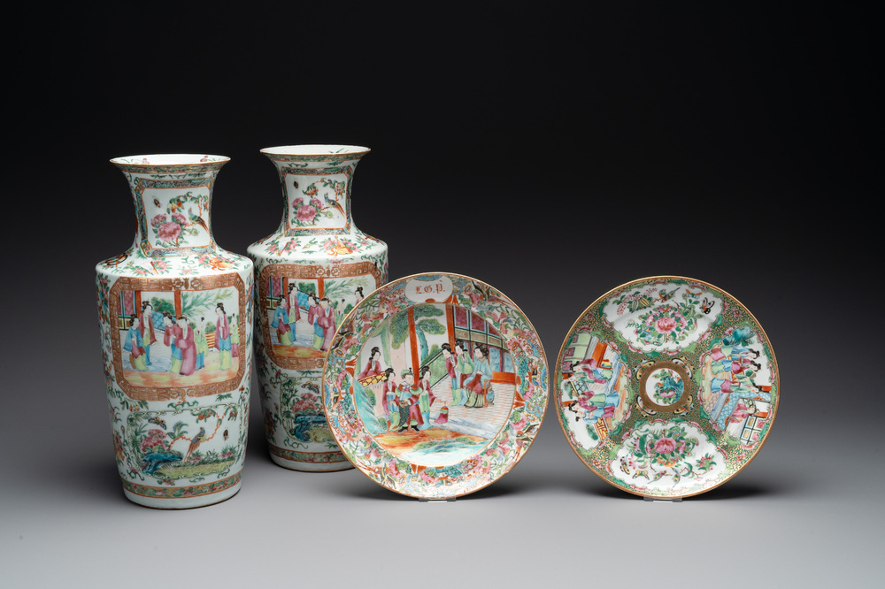 A pair of Chinese Canton famille rose vases and two plates, 19th C.