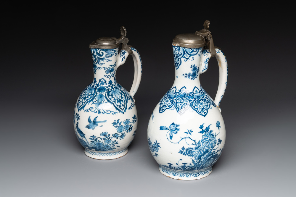 Two blue and white Dutch Delft jugs with pewter mounts, early 18th C.
