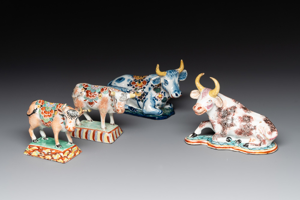 Four polychrome and petit feu Dutch Delft cows, 18th C.