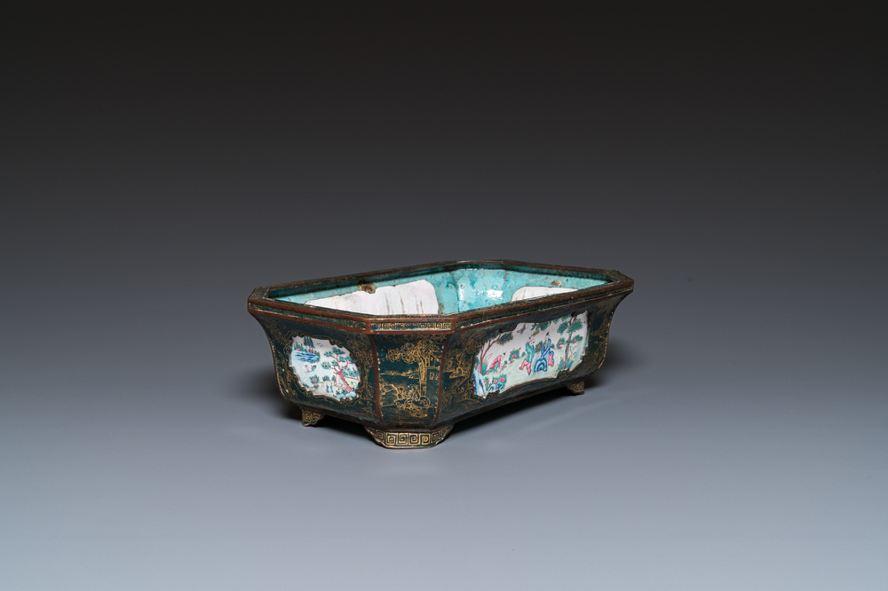 A Chinese Canton enamel gilt-decorated dark-green-ground jardini&egrave;re with four inserted plaques, Qianlong/Jiaqing