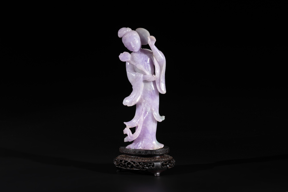 A Chinese lavender- and mint-green-jade figure of a goddess holding a sceptre and fan on wooden stand, 19th C.