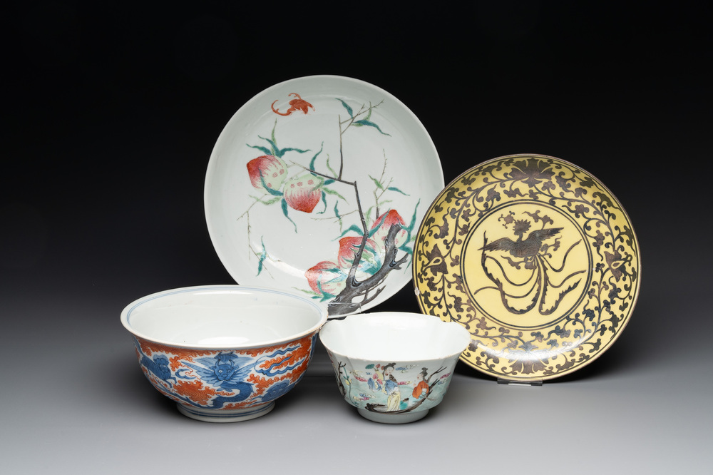 A Chinese famille rose bowl, a 'peaches' plate, a blue and white and iron-red bowl and a 'phoenix' plate, Wanli and Jiaqing marks, 19th C.