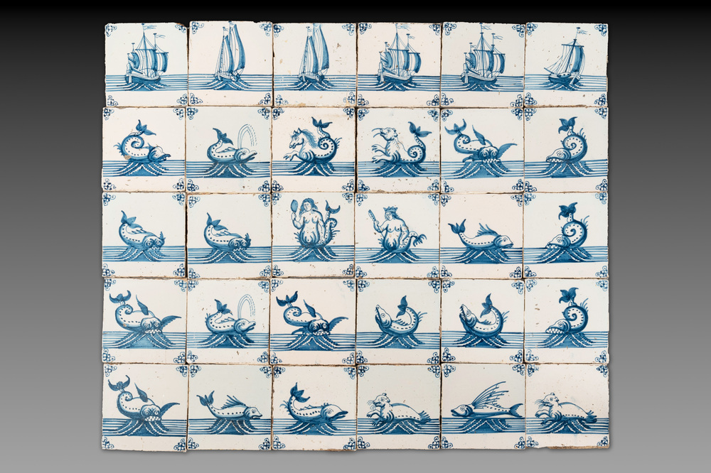 A field of 30 Dutch Delft blue and white tiles with sea creatures and ships, 18th C.