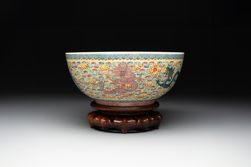 A Chinese famille rose turquoise-and-yellow-ground 'dragon' bowl on wooden stand, Qianlong mark, Republic
