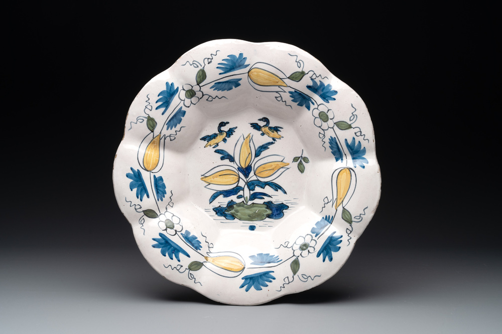A polychrome Dutch Delft dish with ducks and flowers, late 17th C.