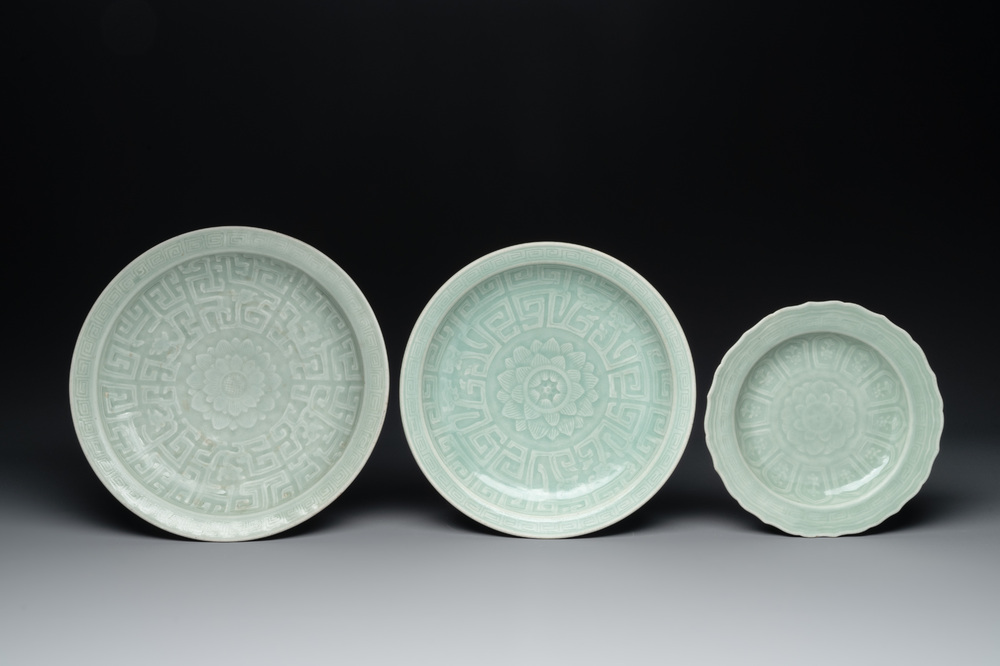Three Chinese celadon-glazed dishes with floral anhua design, 18/19th C.