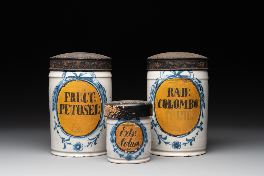 Three rare blue and white Delftware albarelli with painted content medallions and paper shop labels, Northern Europe, 18th C.