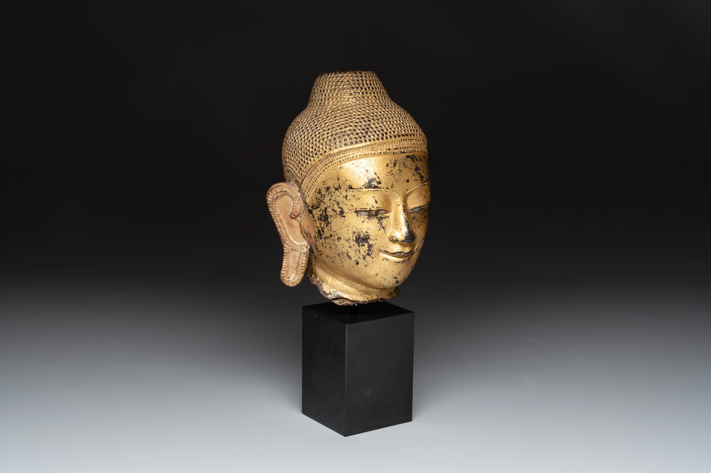 A Burmese gilt-lacquered bronze head of Buddha, 19th C.