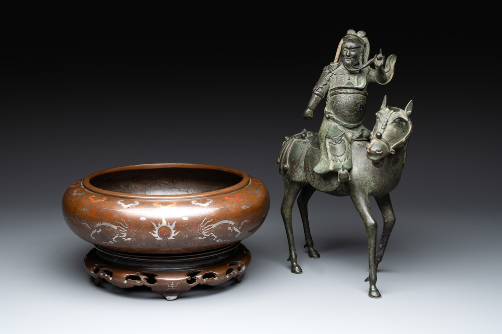A Vietnamese bronze brush washer on stand and a Chinese bronze warrior on horseback, 19th C.