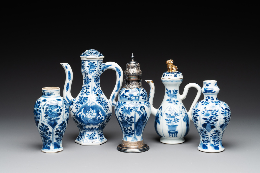 Two Chinese blue and white ewers and three vases, one silver mounted, Kangxi