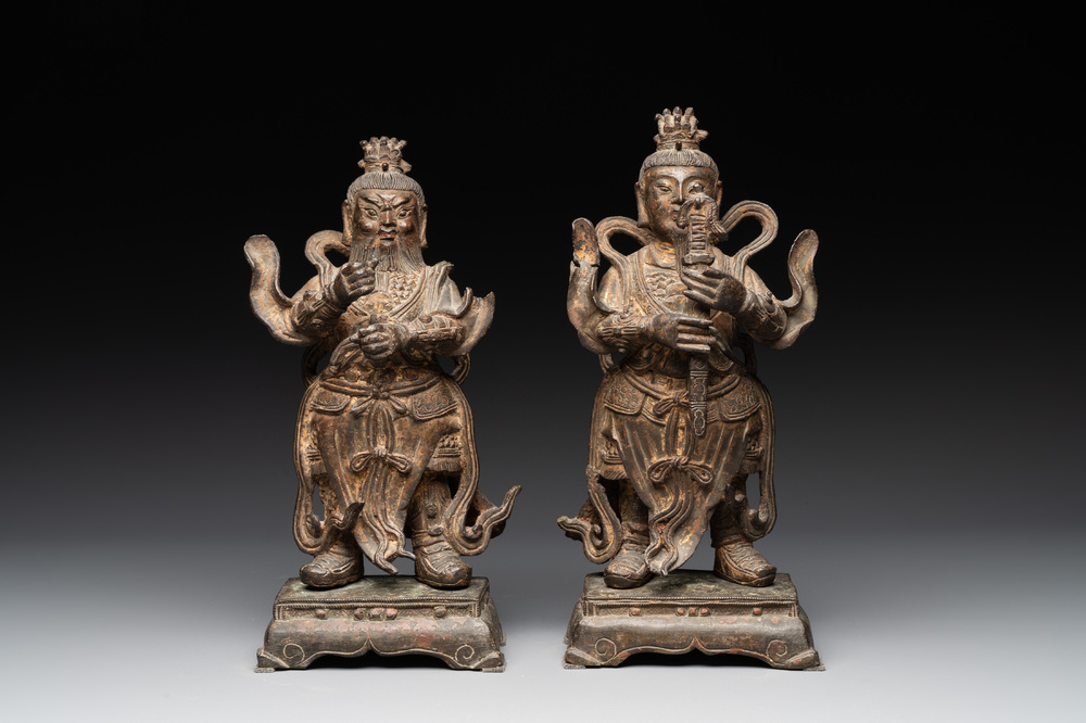 A pair of fine Chinese gilt bronze heavenly kings on stand, Ming