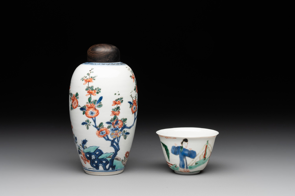 A Chinese famille verte ovoid tea caddy with floral design and a cup with figural design, Kangxi