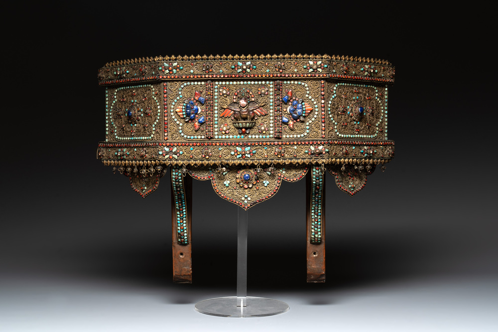 A Nepalese gilt copper console inlaid with glass, precious stones and red coral, 19th C.