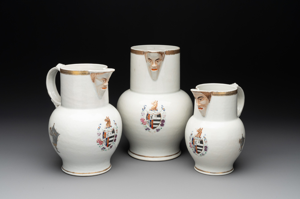 Three Chinese famille rose armorial 'face' ewers with the arms of Thomas Hankey, Qianlong