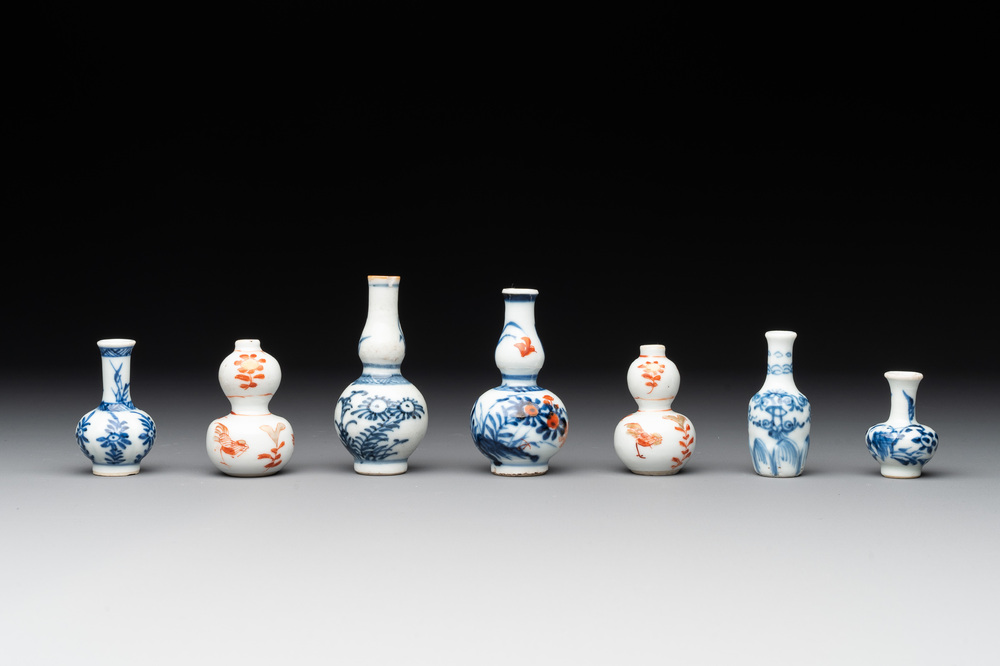 Seven Chinese iron-red, blue and white miniature vases, Kangxi
