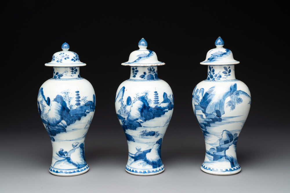 Three Chinese blue and white 'river landscape' vases and covers, Kangxi