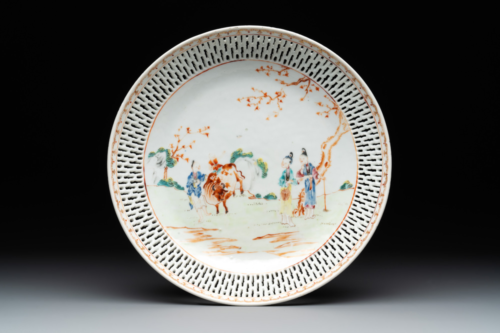 A Chinese famille rose 'mandarin subject' dish with a reticulated border, Qianlong