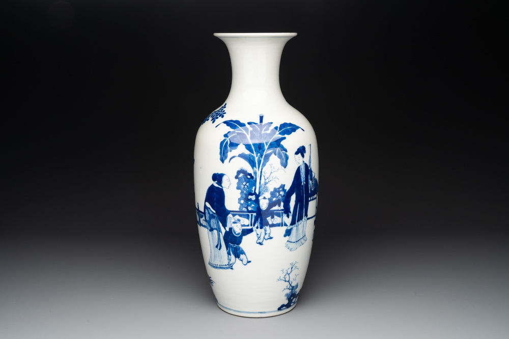 A Chinese blue and white vase with ladies and playing boys in a garden, 19th C.