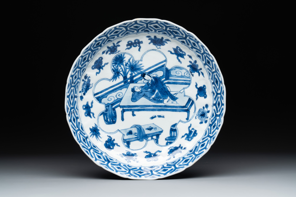 A Chinese blue and white 'erotic scene' plate, Kangxi