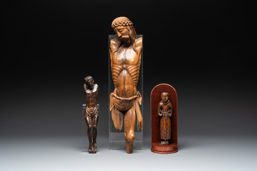 Two carved wooden Corpi Christi and a figure of a monk, Spain and Goa, 16th C.
