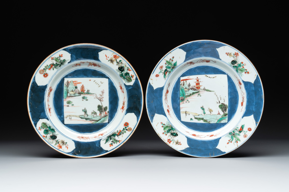 A pair of Chinese famille verte blue-ground 'landscape' plates, Kangxi/Yongzheng