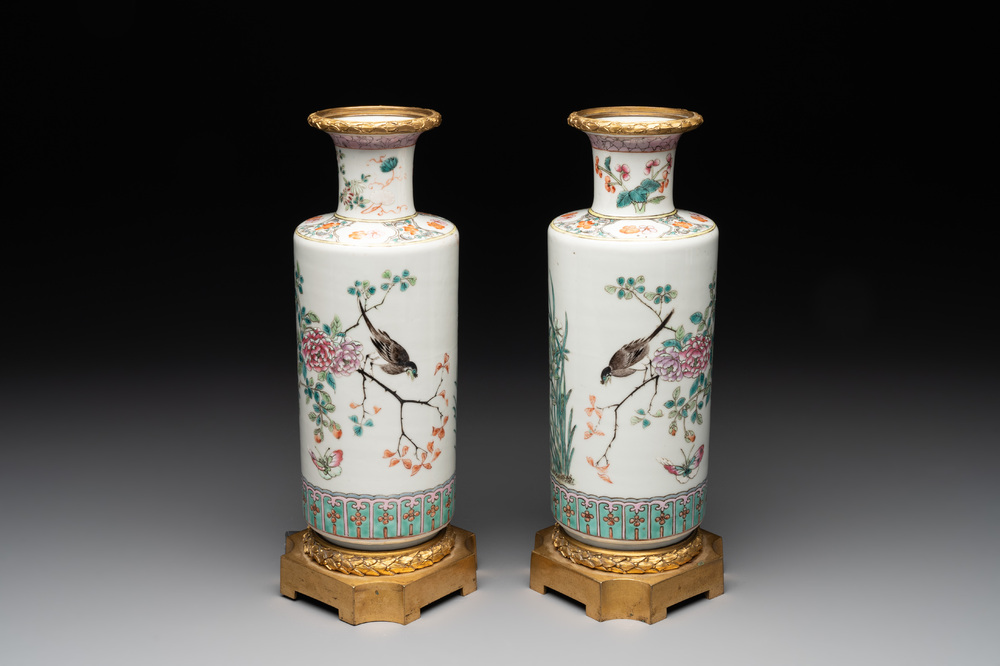 A pair of Chinese famille rose gilt-bronze-mounted 'birds among flowering branches' vases, 19th C.