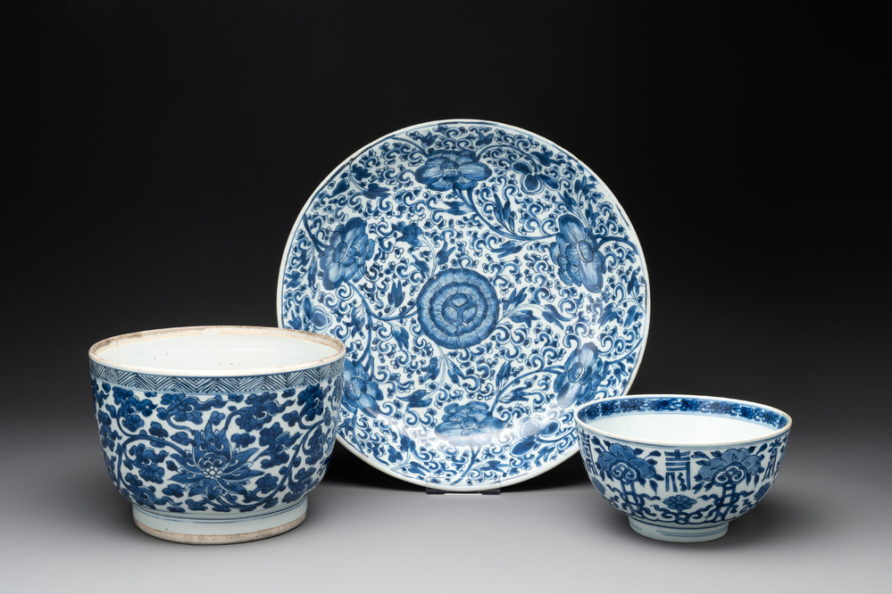 A Chinese blue and white 'lotus' jardini&egrave;re, a 'peony' dish and a 'shou' bowl, Kangxi