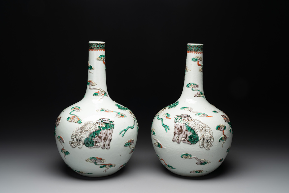 A pair of Chinese famille verte relief-decorated 'animals' vases, 19th C.