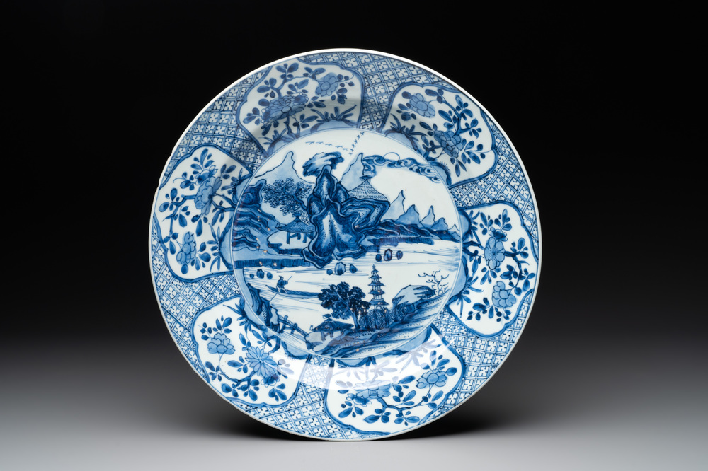 A Chinese blue and white 'mountainous river landscape' dish, lozenge mark, Kangxi