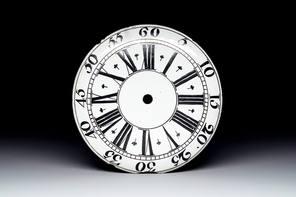 An English Delftware clock face dial with Roman numerals, 18th C.