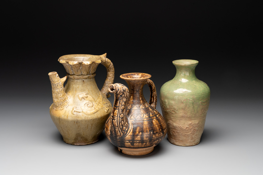 Two Chinese brown-glazed ewers and a celadon-glazed vase, one ewer dated 1571 with a Longqing mark, Qing