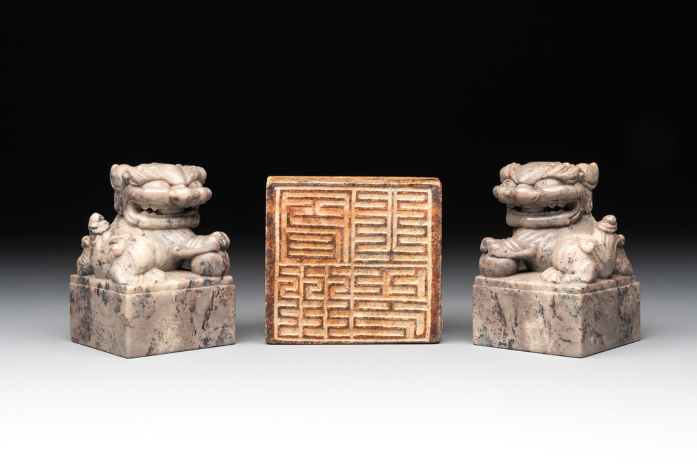 A pair of Chinese grey marble 'lion' seals and a seal, 20th C.