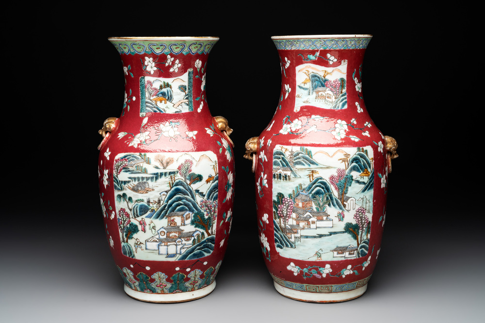 A pair of Chinese famille rose ruby-ground 'landscape' vases, 19th C.