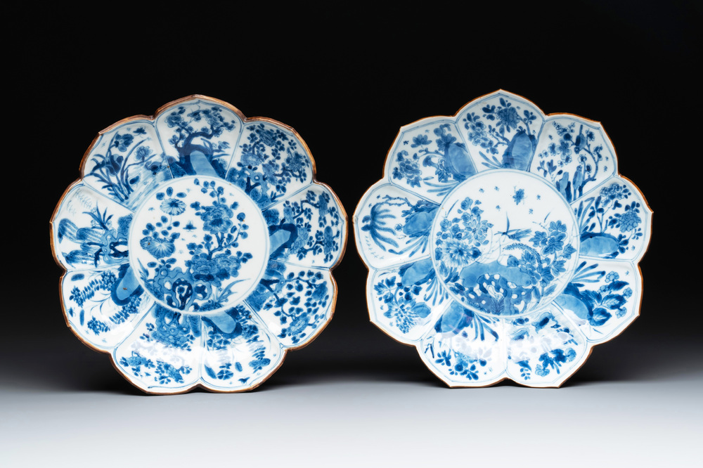A pair of Chinese lotus-shaped blue and white plates with floral design, yu mark, Kangxi
