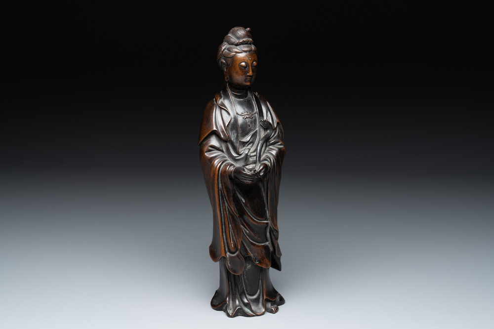 A Chinese bronze Guanyin holding a ruyi, 17/18th C.