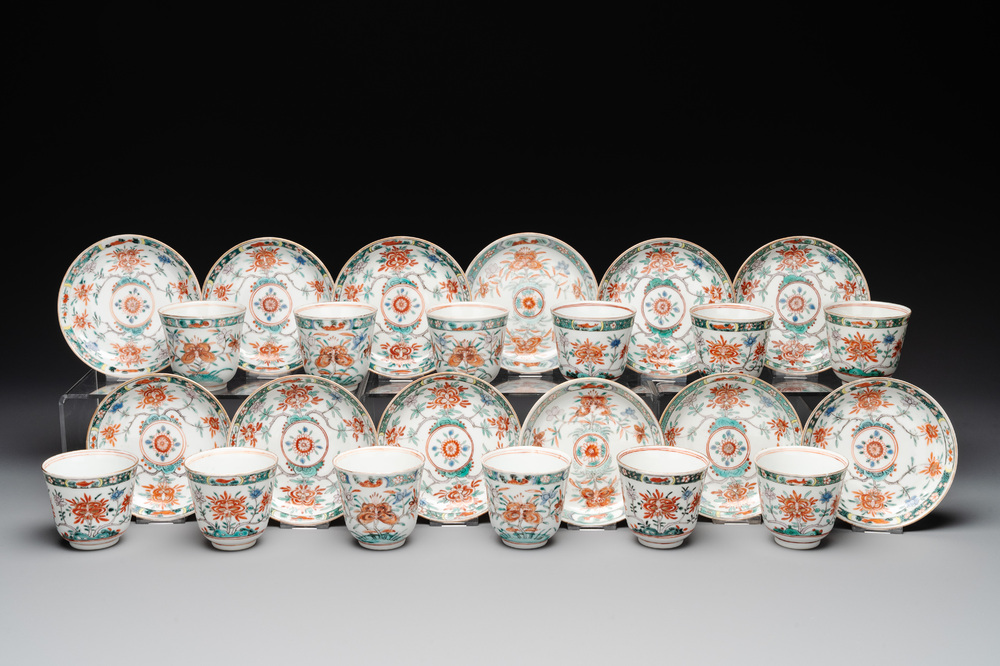 A set of 12 Chinese famille verte cups and saucers with floral design, Kangxi