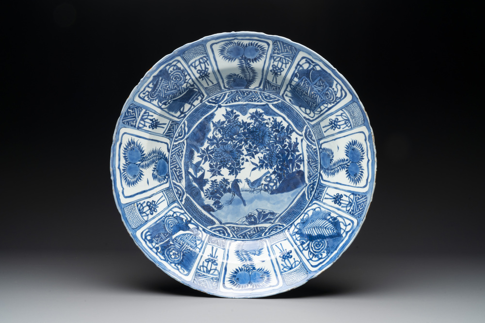 A large Chinese blue and white 'kraak' dish with birds among flowering branches, Wanli