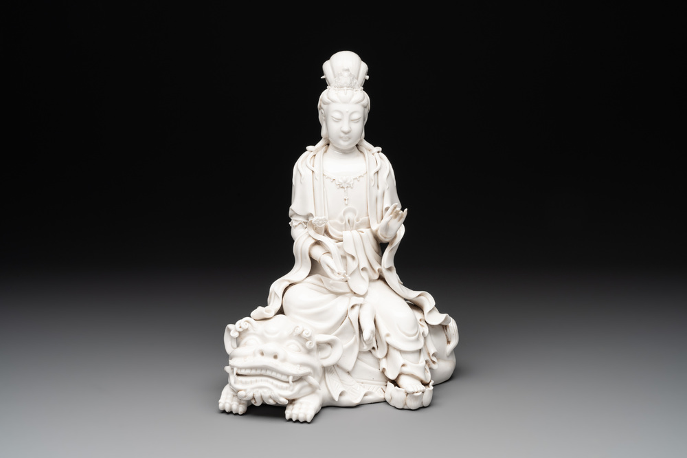 A Chinese Dehua blanc de Chine Guanyin seated on a lion, 20th C.
