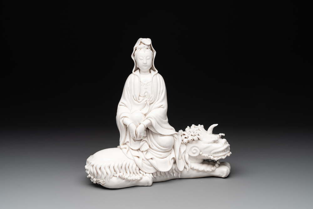 A Chinese Dehua blanc de Chine Guanyin seated on a Buddhist lion, 20th C.
