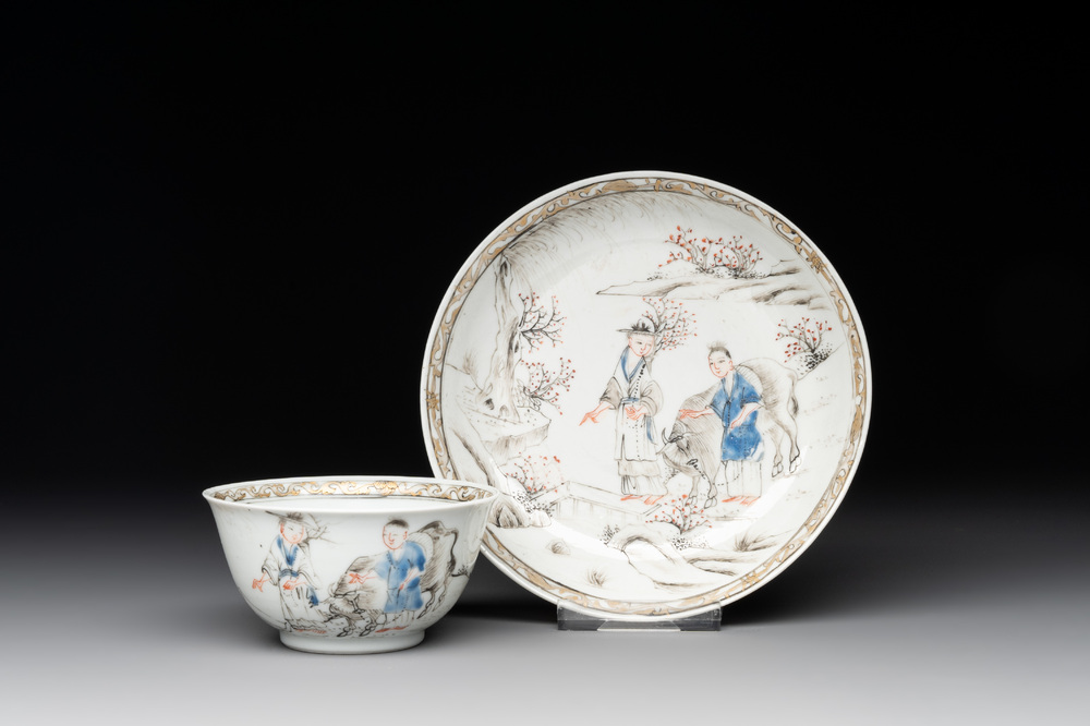 A Chinese blue-enamelled gilt-decorated grisaille cup and saucer, Yongzheng