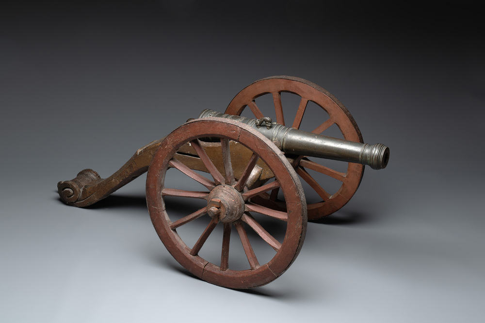 A Dutch bronze saluting cannon on a partly original carriage, inscribed C. Ouderogge Fecit, Rotterdam, dated 1641