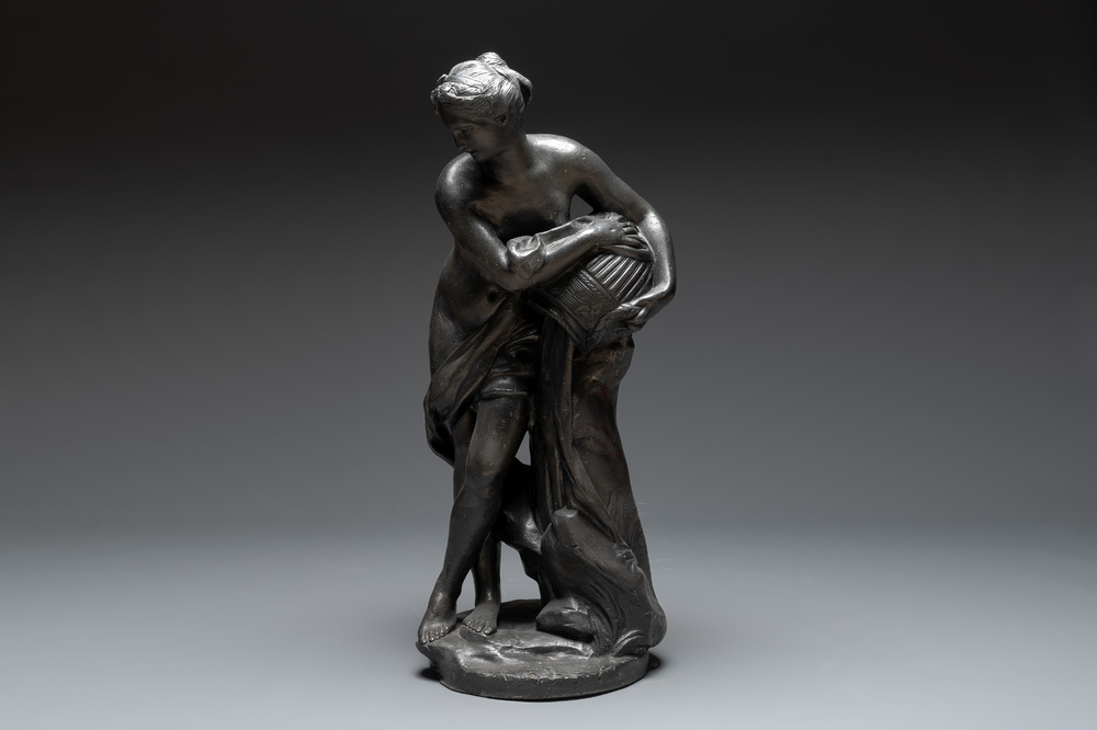 A lead sculpture of a lady pouring water, 19th C.