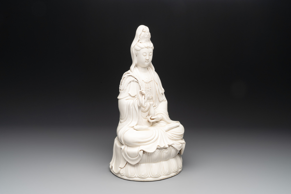 A Chinese Dehua blanc de Chine Guanyin seated on a lotus throne, 20th C.