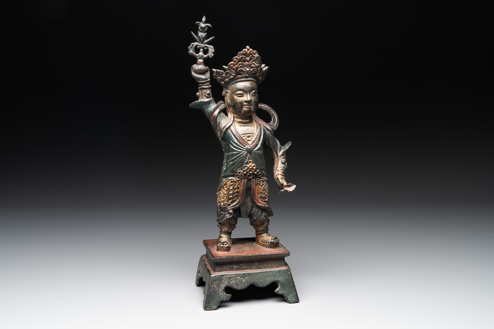 A Chinese gilt-lacquered bronze guardian, Ming